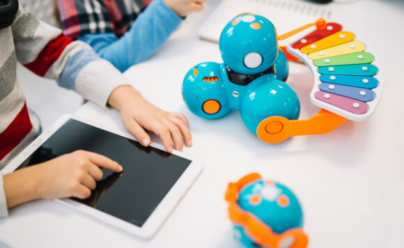 Child playing augmented reality game with physical toys - Boost Early Childhood Development with Educational Toys