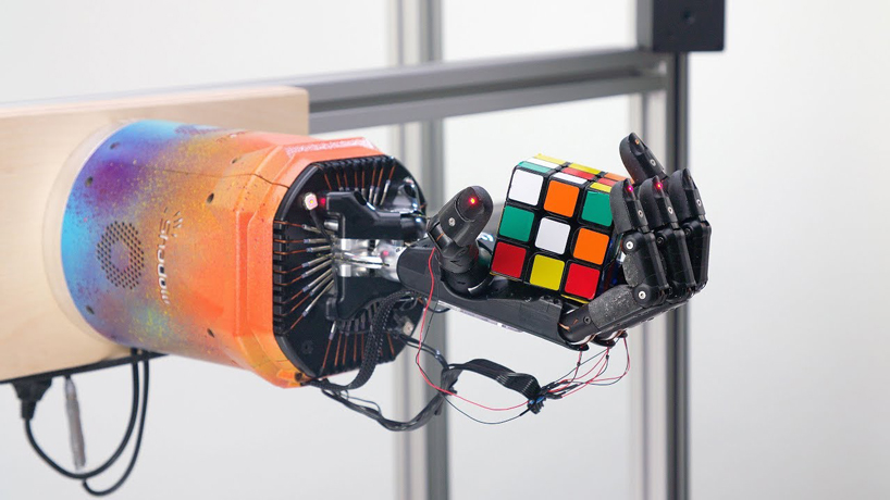 robot arm solving Rubik's Cube - extremely dextrous robot arm uses AI to solve rubik's cube one-handed